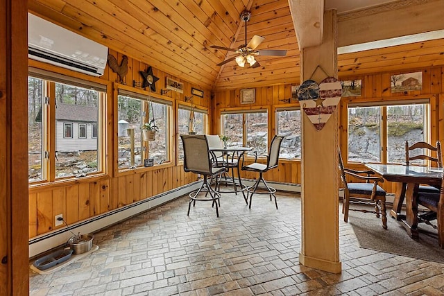 sunroom / solarium featuring lofted ceiling, a wall mounted air conditioner, wooden walls, brick floor, and a baseboard radiator