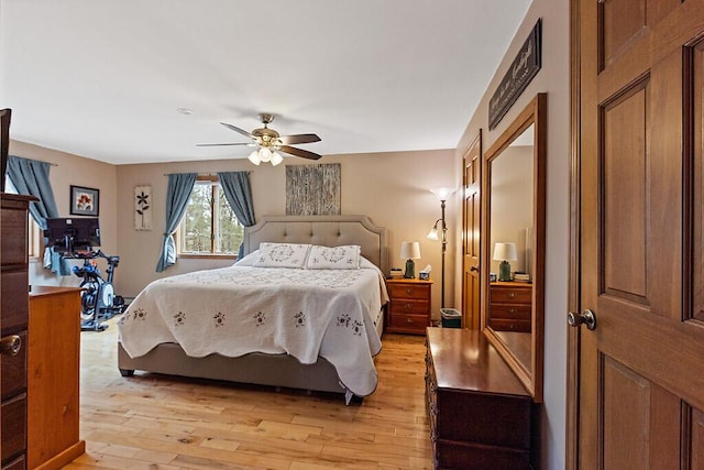 bedroom with ceiling fan and light wood finished floors