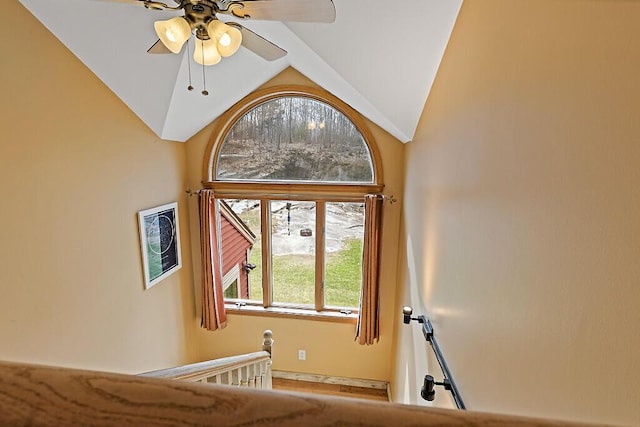 interior space with ceiling fan and lofted ceiling
