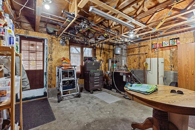 below grade area with a heating unit and water heater