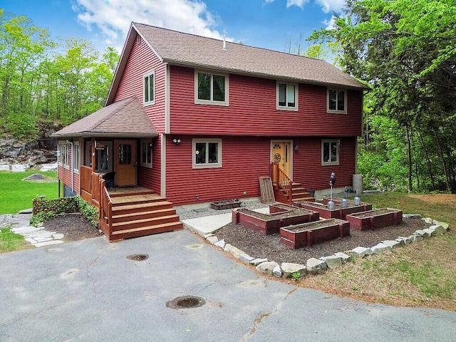 140 Old Belgrade Rd, Augusta, ME 04330 - view of front facade with a shingled roof and covered porch
