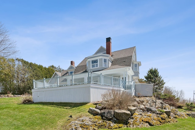 168 Ocean Ave, Kennebunkport, ME 04046 - rear view of house with a lawn, a deck, a chimney, and a shingled roof