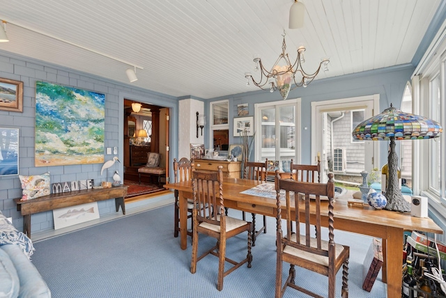 168 Ocean Ave, Kennebunkport, ME 04046 - carpeted dining room featuring a notable chandelier