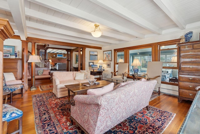 168 Ocean Ave, Kennebunkport, ME 04046 - living room featuring beamed ceiling, wood-type flooring, and decorative columns