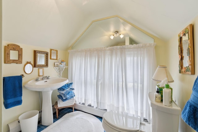 168 Ocean Ave, Kennebunkport, ME 04046 - bathroom with tile patterned floors, vaulted ceiling, and toilet