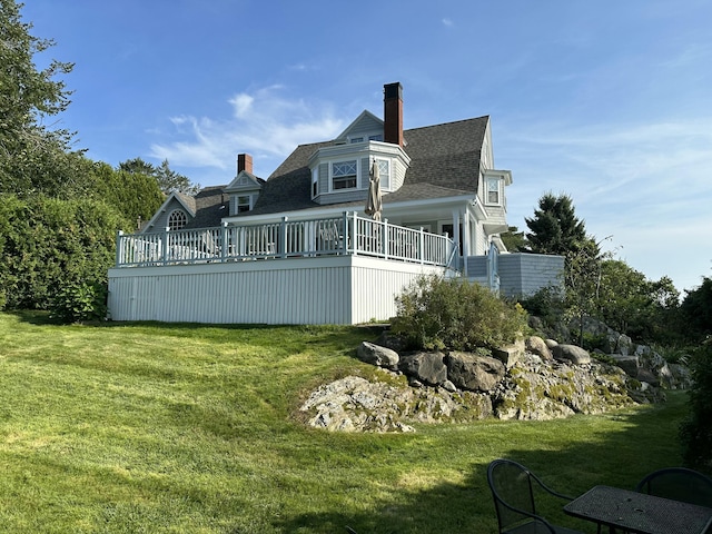 168 Ocean Ave, Kennebunkport, ME 04046 - back of property with a yard, a deck, a chimney, and a shingled roof