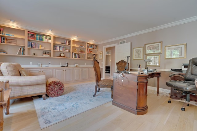 living area featuring visible vents, ornamental molding, and light wood-style flooring