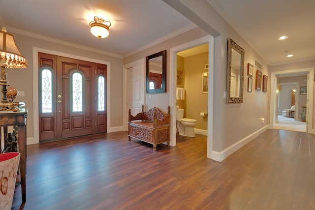 entryway with crown molding, recessed lighting, dark wood-style flooring, and baseboards