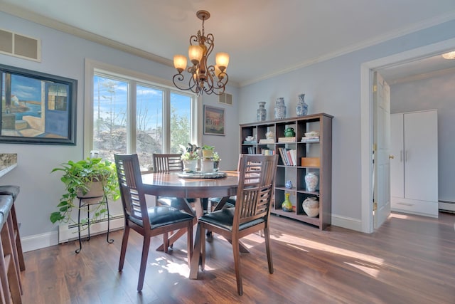 dining area with visible vents, a baseboard heating unit, wood finished floors, and a chandelier
