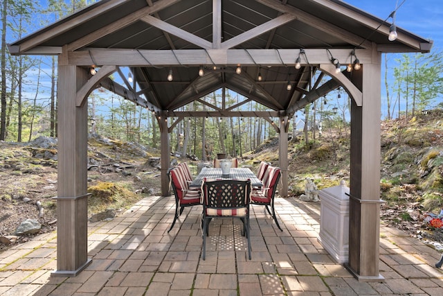 view of patio / terrace featuring a gazebo and outdoor dining space