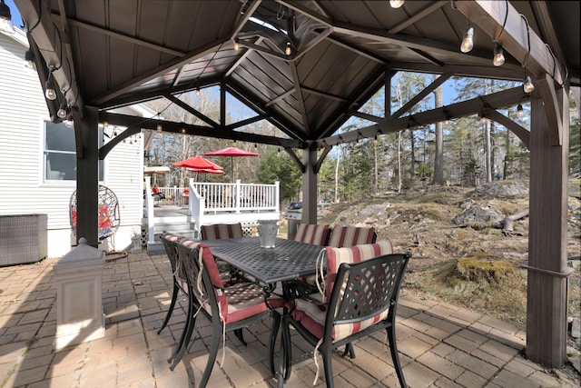 view of patio / terrace featuring a gazebo and outdoor dining space