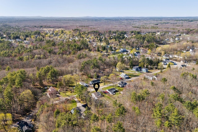 bird's eye view featuring a wooded view
