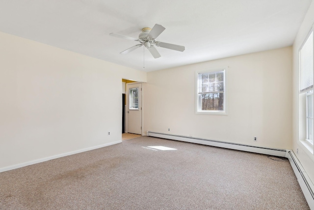 unfurnished room featuring baseboard heating, a ceiling fan, and light colored carpet