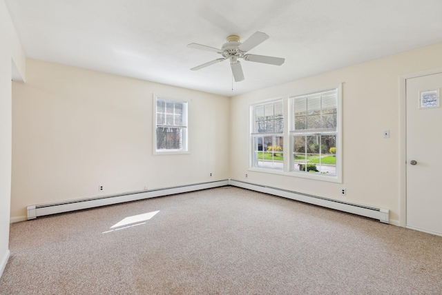carpeted empty room with a ceiling fan, baseboards, and baseboard heating