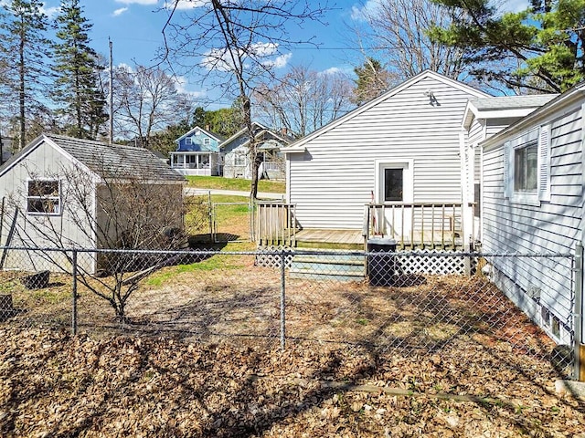 view of yard featuring a wooden deck and fence