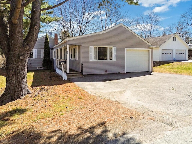 view of front of property with a garage and aphalt driveway