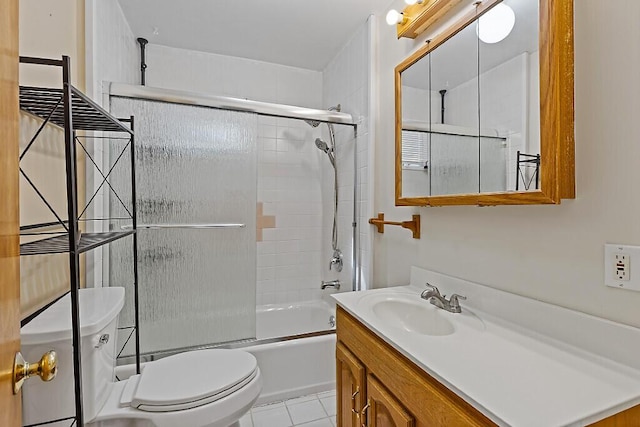bathroom featuring tile patterned floors, toilet, bath / shower combo with glass door, and vanity
