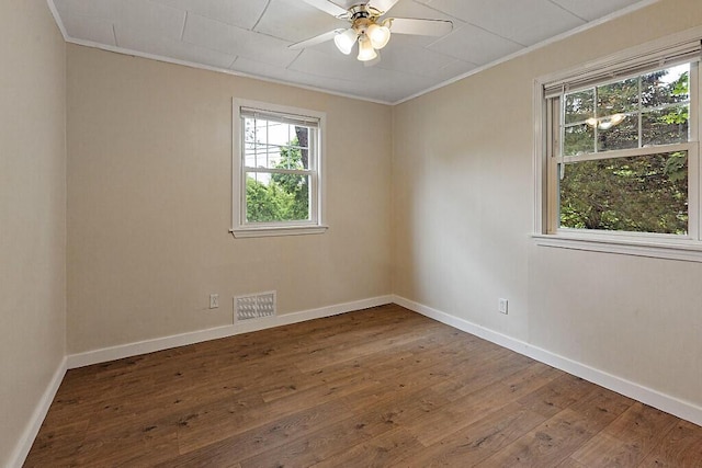 10 Field St, Bangor, ME 04401 - empty room with crown molding, plenty of natural light, hardwood / wood-style floors, a ceiling fan, and baseboards