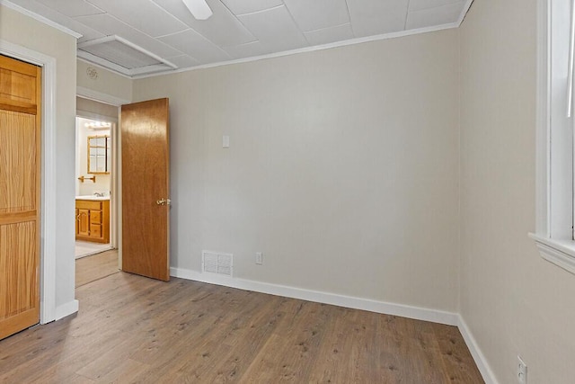 10 Field St, Bangor, ME 04401 - empty room featuring ornamental molding, wood finished floors, baseboards, and a sink