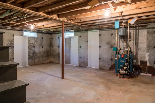 below grade area with a heating unit