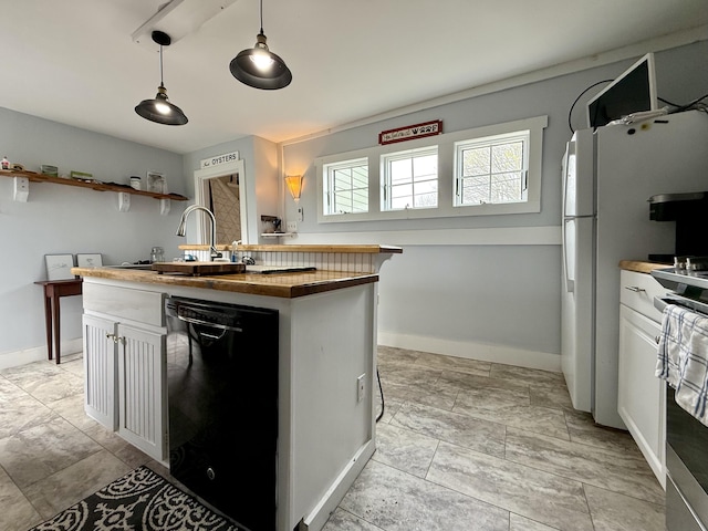12 Prince Ave, Eastport, ME 04631 - kitchen with black dishwasher, butcher block counters, stainless steel electric range, baseboards, and white cabinetry