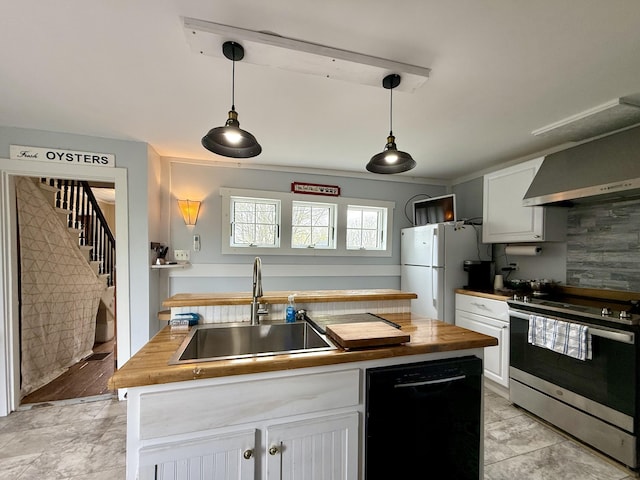 12 Prince Ave, Eastport, ME 04631 - kitchen with dishwasher, stainless steel range with electric cooktop, a sink, wall chimney range hood, and freestanding refrigerator