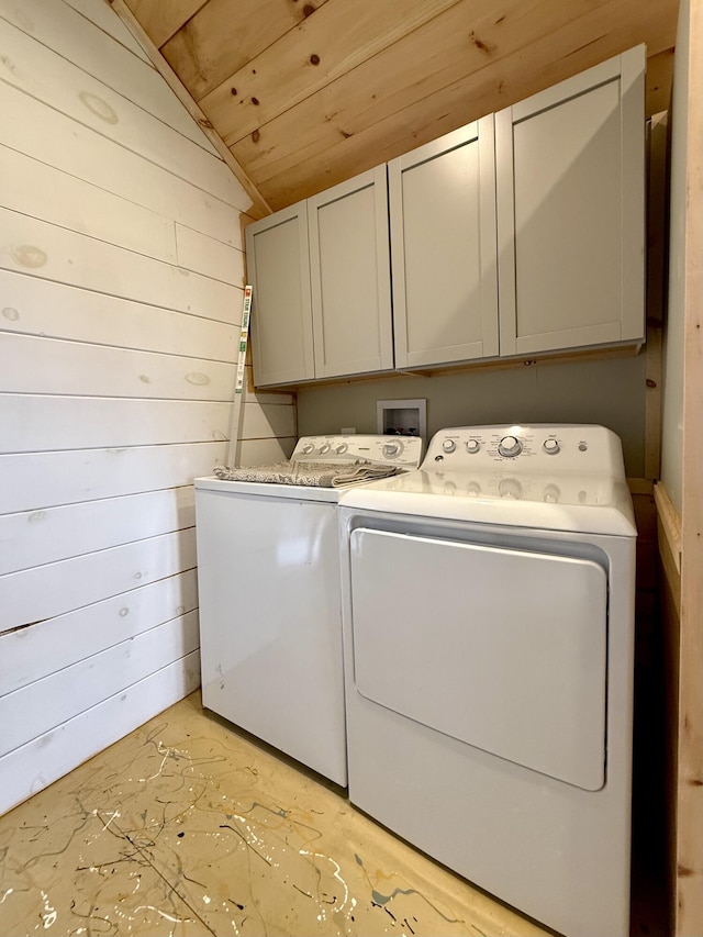 12 Prince Ave, Eastport, ME 04631 - laundry area featuring cabinet space, washer and clothes dryer, wood ceiling, and wooden walls