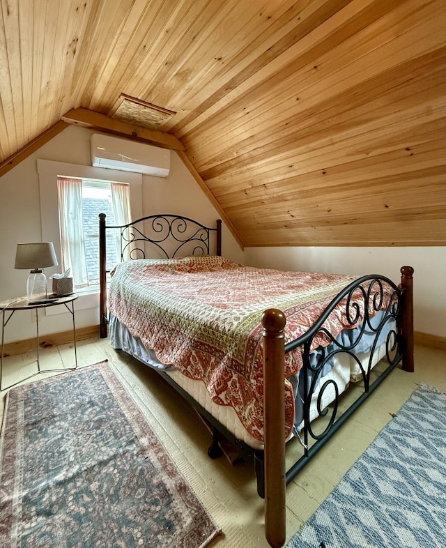 12 Prince Ave, Eastport, ME 04631 - bedroom with a wall mounted AC, wood ceiling, vaulted ceiling, and baseboards