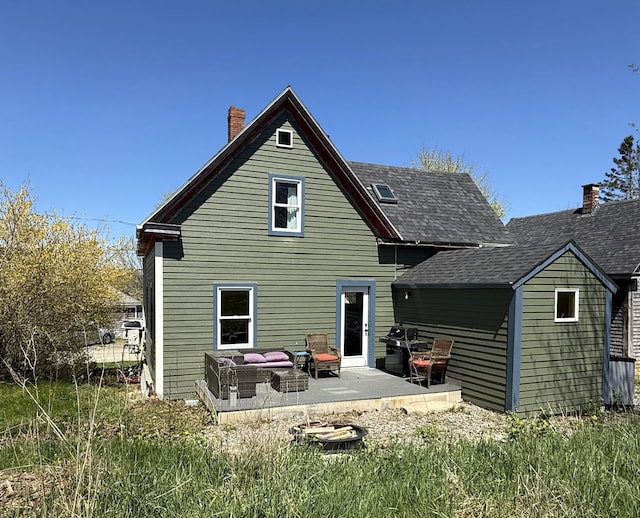 12 Prince Ave, Eastport, ME 04631 - rear view of property with a chimney and a patio area
