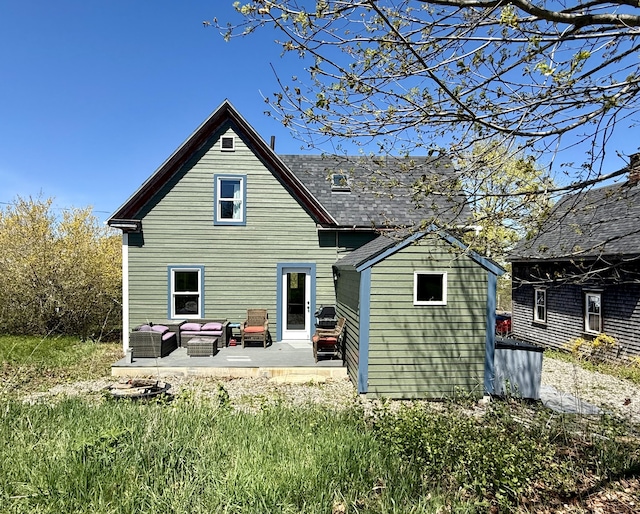 12 Prince Ave, Eastport, ME 04631 - rear view of property featuring a patio area and outdoor lounge area