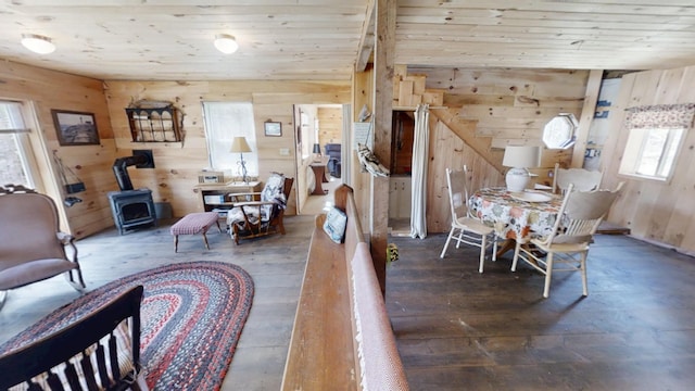 305 Main St N, Searsmont, ME 04973 - dining area with wood walls, a wood stove, wood-type flooring, and wood ceiling