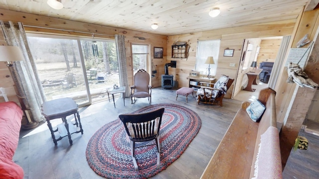 305 Main St N, Searsmont, ME 04973 - interior space with a wood stove, wood walls, wood finished floors, and wood ceiling