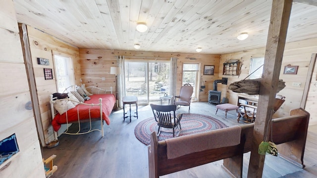 305 Main St N, Searsmont, ME 04973 - living area featuring wood ceiling, wooden walls, wood finished floors, and a wood stove