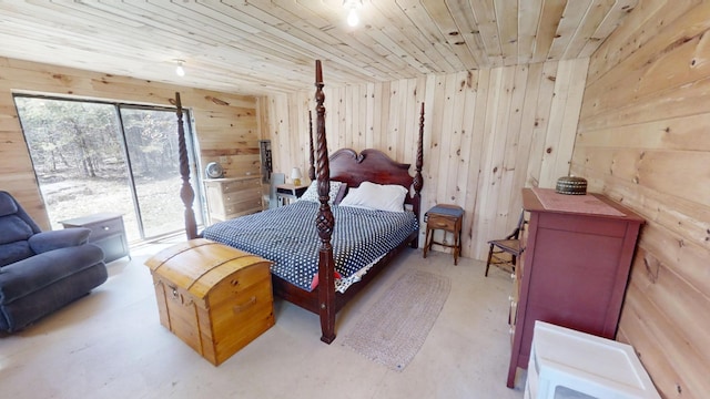 305 Main St N, Searsmont, ME 04973 - bedroom with access to exterior, wooden ceiling, wood walls, and concrete flooring
