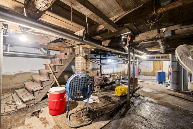 unfinished below grade area featuring stairs and gas water heater