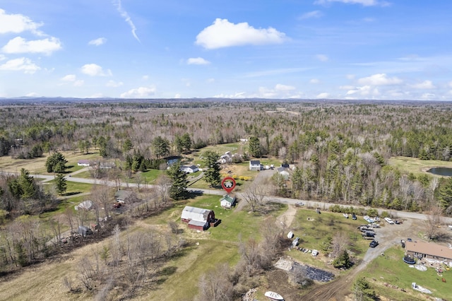 drone / aerial view featuring a view of trees