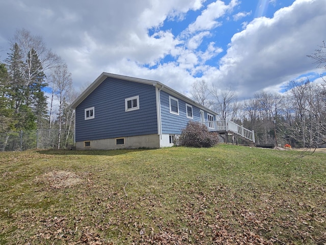 57 Owlsboro Rd, Mount Chase, ME 04765 - view of home's exterior with stairs, a yard, and fence