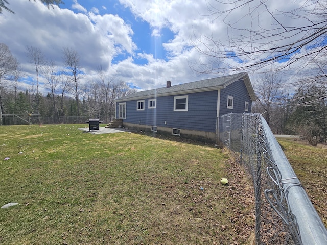 57 Owlsboro Rd, Mount Chase, ME 04765 - back of property featuring a patio, a yard, a chimney, and fence