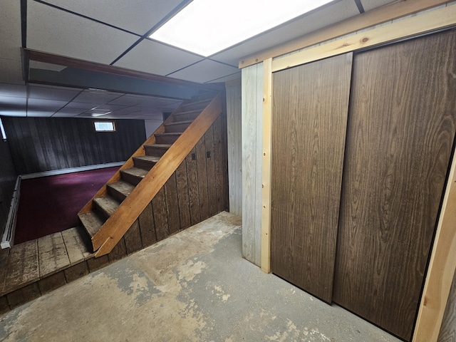 57 Owlsboro Rd, Mount Chase, ME 04765 - finished below grade area featuring stairway, wooden walls, and a drop ceiling
