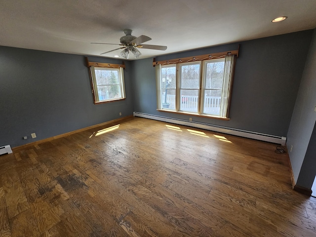 57 Owlsboro Rd, Mount Chase, ME 04765 - spare room with a ceiling fan, wood finished floors, and a baseboard heating unit