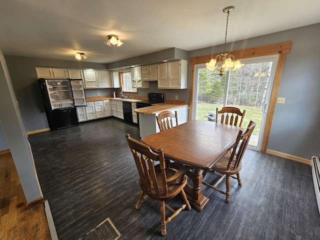 57 Owlsboro Rd, Mount Chase, ME 04765 - dining room featuring a healthy amount of sunlight, a chandelier, and baseboards