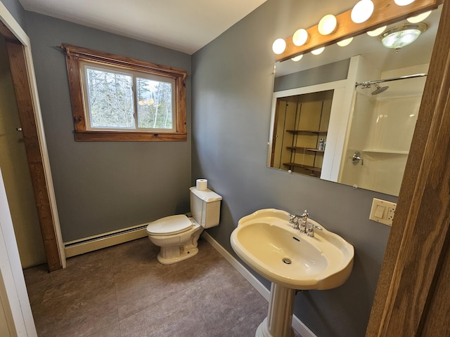 57 Owlsboro Rd, Mount Chase, ME 04765 - bathroom with a sink, a shower, a baseboard radiator, baseboards, and toilet