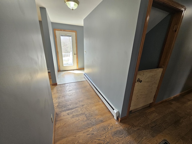 57 Owlsboro Rd, Mount Chase, ME 04765 - hallway with a baseboard heating unit, wood finished floors, and baseboards