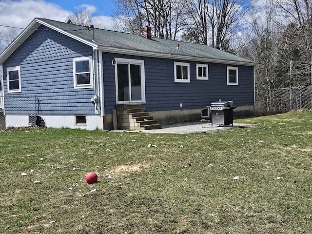 57 Owlsboro Rd, Mount Chase, ME 04765 - rear view of house with a chimney, a yard, fence, entry steps, and a patio area