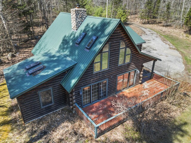 48 Thistle Ln, Sidney, ME 04330 - rear view of property with metal roof, log siding, a chimney, a forest view, and a wooden deck