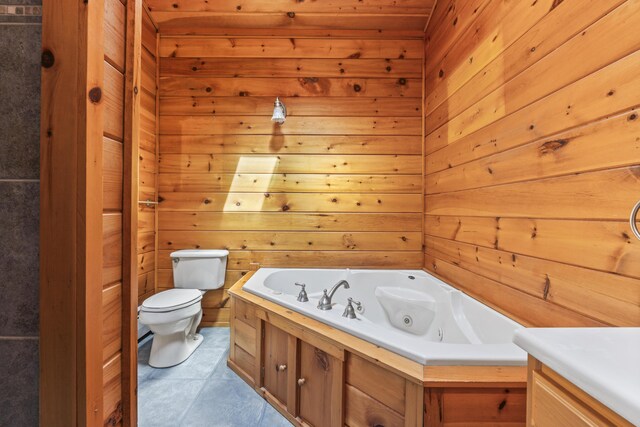 48 Thistle Ln, Sidney, ME 04330 - bathroom with toilet, a whirlpool tub, wood walls, and tile patterned flooring