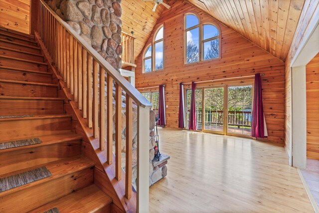 48 Thistle Ln, Sidney, ME 04330 - stairs with wood ceiling, high vaulted ceiling, wood walls, and wood finished floors
