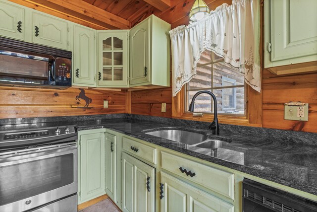 48 Thistle Ln, Sidney, ME 04330 - kitchen featuring stainless steel range with electric cooktop, green cabinets, a sink, black microwave, and wooden walls