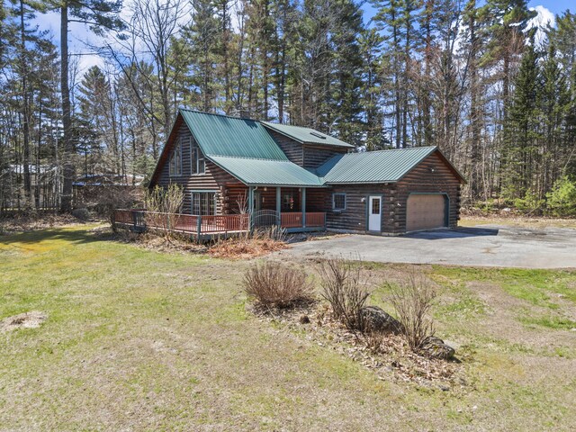 48 Thistle Ln, Sidney, ME 04330 - log home with log siding, asphalt driveway, a front yard, an attached garage, and metal roof