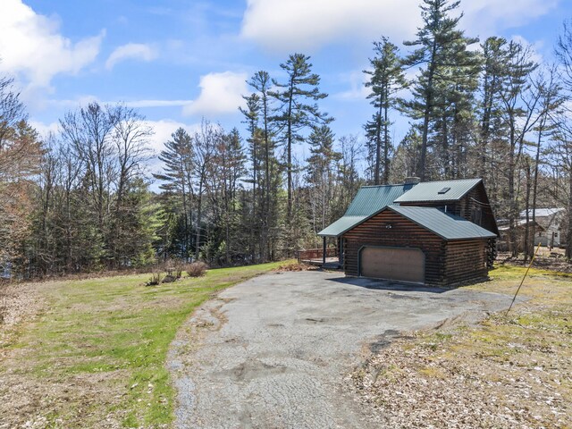 48 Thistle Ln, Sidney, ME 04330 - garage featuring driveway